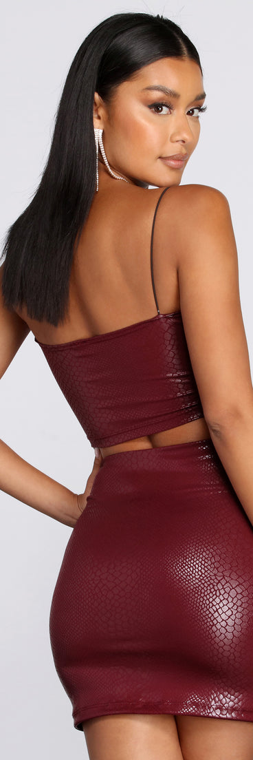 With fun and flirty details, Set Me Up With Snake Crop Top shows off your unique style for a trendy outfit for the summer season!