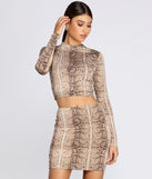 With fun and flirty details, Snake It Up Crop Top shows off your unique style for a trendy outfit for the summer season!