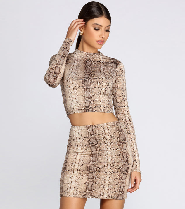 With fun and flirty details, Snake It Up Crop Top shows off your unique style for a trendy outfit for the summer season!
