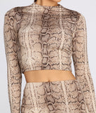 With fun and flirty details, Snake It Up Crop Top shows off your unique style for a trendy outfit for the summer season!