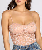 With fun and flirty details, World Class Sweetheart Lace Rhinestone Bodysuit shows off your unique style for a trendy outfit for the summer season!