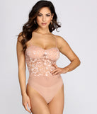 With fun and flirty details, World Class Sweetheart Lace Rhinestone Bodysuit shows off your unique style for a trendy outfit for the summer season!