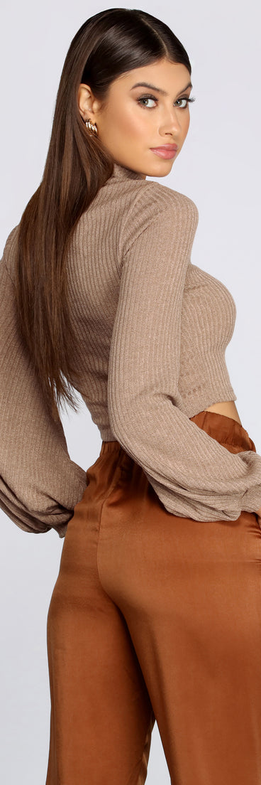 With fun and flirty details, Balloon Sleeve Mock Neck Crop Top shows off your unique style for a trendy outfit for the summer season!