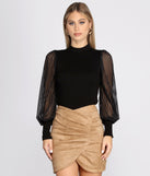 With fun and flirty details, Sheer Balloon Sleeve Mock Neck Top shows off your unique style for a trendy outfit for the summer season!