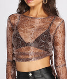 With fun and flirty details, Sultry Sheer Snake Print Crop Top shows off your unique style for a trendy outfit for the summer season!