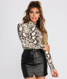 With fun and flirty details, Snake Print Mock Neck Knit Top shows off your unique style for a trendy outfit for the summer season!