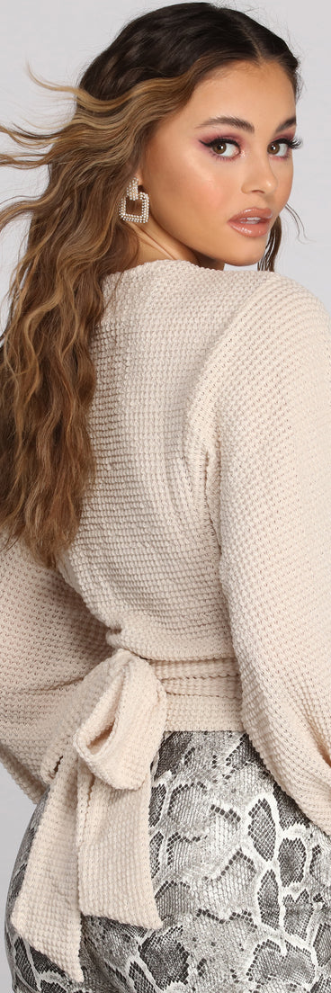 With fun and flirty details, Textured Knit Wrap Front Top shows off your unique style for a trendy outfit for the summer season!