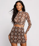 With fun and flirty details, Sultry And Stunning Snake Print Crop Top shows off your unique style for a trendy outfit for the summer season!