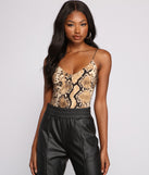 Wild And Free Snake Print Bodysuit is a trendy pick to create 2023 festival outfits, festival dresses, outfits for concerts or raves, and complete your best party outfits!