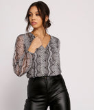 With fun and flirty details, Viper Vixen Snake Print Mesh Top shows off your unique style for a trendy outfit for the summer season!