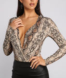 With fun and flirty details, Sleek and Stylish Snake Print Surplice Bodysuit shows off your unique style for a trendy outfit for the summer season!
