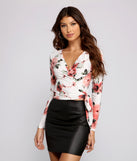 The trendy Fresh In Floral Wrap-Front Top is the perfect pick to create a holiday outfit, new years attire, cocktail outfit, or party look for any seasonal event!