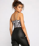 With fun and flirty details, Sassy Stunner Snake Print Crop Top shows off your unique style for a trendy outfit for the summer season!