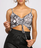 With fun and flirty details, Sassy Stunner Snake Print Crop Top shows off your unique style for a trendy outfit for the summer season!