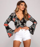The trendy Tropical Getaway Wrap Crop Top is the perfect pick to create a holiday outfit, new years attire, cocktail outfit, or party look for any seasonal event!