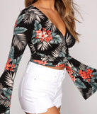 With fun and flirty details, Tropical Getaway Wrap Crop Top shows off your unique style for a trendy outfit for the summer season!
