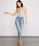 With fun and flirty details, Fierce Vixen Crepe Snake Print Bodysuit shows off your unique style for a trendy outfit for the summer season!