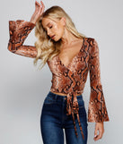 With fun and flirty details, She's Stylin' Snake Print Top shows off your unique style for a trendy outfit for the summer season!