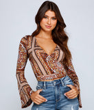 The trendy Boho Dreamer Printed Wrap Top is the perfect pick to create a holiday outfit, new years attire, cocktail outfit, or party look for any seasonal event!