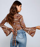 With fun and flirty details, Boho Dreamer Printed Wrap Top shows off your unique style for a trendy outfit for the summer season!