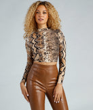 With fun and flirty details, Flirty Fierce Snake Print Crop Top shows off your unique style for a trendy outfit for the summer season!