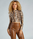 With fun and flirty details, Flirty Fierce Snake Print Crop Top shows off your unique style for a trendy outfit for the summer season!