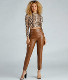 With fun and flirty details, Flirty Fierce Snake Print Crop Top shows off your unique style for a trendy outfit for the summer season!
