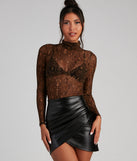 Sexy Slither Mesh Turtleneck Top creates the perfect New Year’s Eve Outfit or new years dress with stylish details in the latest trends to ring in 2023!