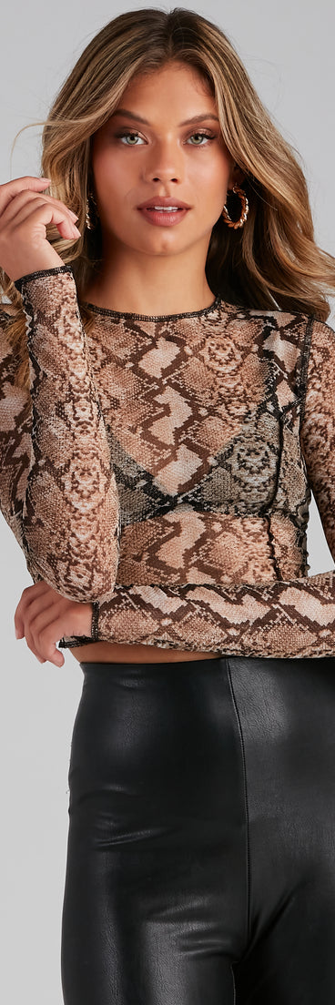 The trendy Sultry Snake Mesh Seam Detail Top is the perfect pick to create a holiday outfit, new years attire, cocktail outfit, or party look for any seasonal event!