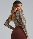 With fun and flirty details, Twist Of Fate Snake Print Crop Top shows off your unique style for a trendy outfit for the summer season!
