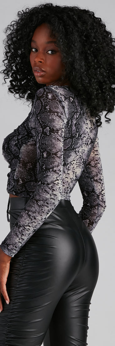 With fun and flirty details, Snake It Mesh Lace-Up Top shows off your unique style for a trendy outfit for the summer season!