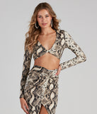 With fun and flirty details, See Ya Later Snake Twist Crop Top shows off your unique style for a trendy outfit for the summer season!