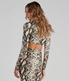 With fun and flirty details, See Ya Later Snake Twist Crop Top shows off your unique style for a trendy outfit for the summer season!