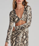 With fun and flirty details, See Ya Later Snake Twist Crop Top shows off your unique style for a trendy outfit for the summer season!