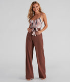 With fun and flirty details, Brush Strokes Tie-Waist Bodysuit shows off your unique style for a trendy outfit for the summer season!