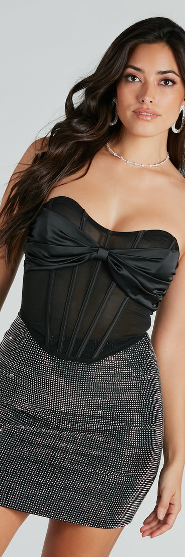 With fun and flirty details, the Fashion Flair Satin Bow Mesh Corset Top shows off your unique style for a trendy outfit for the spring or summer season!