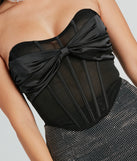With fun and flirty details, the Fashion Flair Satin Bow Mesh Corset Top shows off your unique style for a trendy outfit for the spring or summer season!