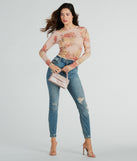 With fun and flirty details, the Elevate The Charm Long Sleeve Floral Mesh Crop Top shows off your unique style for a trendy outfit for summer!