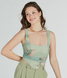 The waist-defining bodice style of the Blooming Beauty Floral Ruched Mesh Corset Top is perfect for making a statement with your outfit and provides the boning, molded cups, or lace-up details that capture the corset trend.