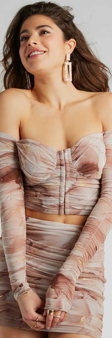 Whether fitted or flowy, the Effortless Darling Off-The-Shoulder Mesh Crop Top is a long-sleeve top that offers endless styling options as a layer or a standalone piece to elevate your outfit for the season.