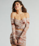 Whether fitted or flowy, the Effortless Darling Off-The-Shoulder Mesh Crop Top is a long-sleeve top that offers endless styling options as a layer or a standalone piece to elevate your outfit for the season.