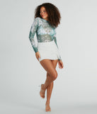 Whether fitted or flowy, the Fresh In Floral Long Sleeve Mesh Crop Top is a long-sleeve top that offers endless styling options as a layer or a standalone piece to elevate your outfit for the season.