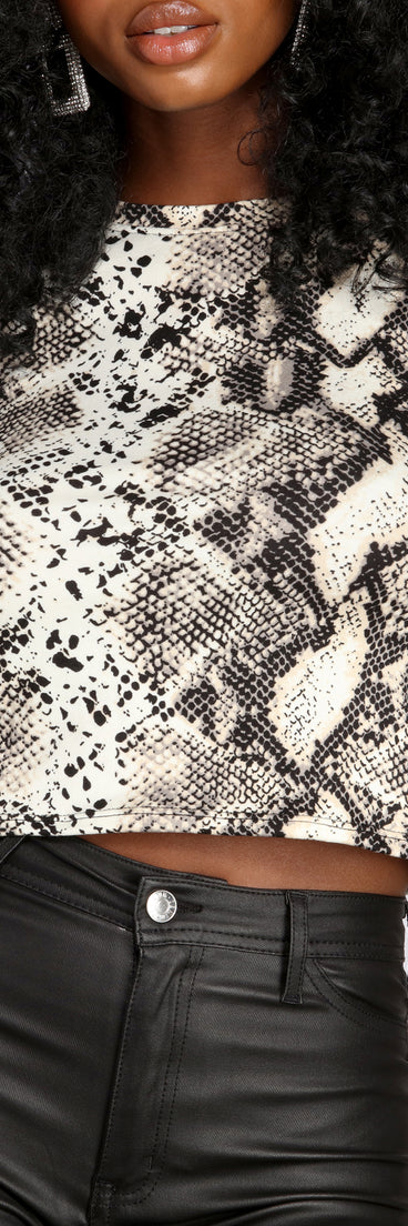 With fun and flirty details, Stand Out In Snake Print Top shows off your unique style for a trendy outfit for the summer season!