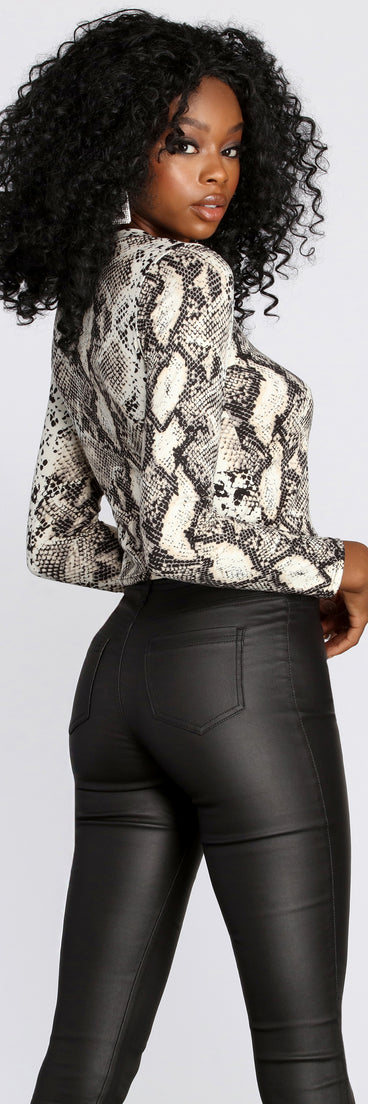 With fun and flirty details, Stand Out In Snake Print Top shows off your unique style for a trendy outfit for the summer season!
