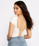 With fun and flirty details, Sassy Strappy Back Cropped Tee shows off your unique style for a trendy outfit for the summer season!