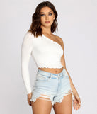 With fun and flirty details, Effortless Edge Ribbed Knit Crop Top shows off your unique style for a trendy outfit for the summer season!