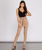 Basic Notch Front Tank Black Bodysuit Outfit styled with Natural Tie Wist Pants and Strappy Black Heels