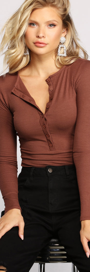 The trendy Button-Front Ribbed Knit Henley Top is the perfect pick to create a holiday outfit, new years attire, cocktail outfit, or party look for any seasonal event!