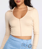 With fun and flirty details, Sporty Chic Collared Zip-Up Crop Top shows off your unique style for a trendy outfit for the summer season!