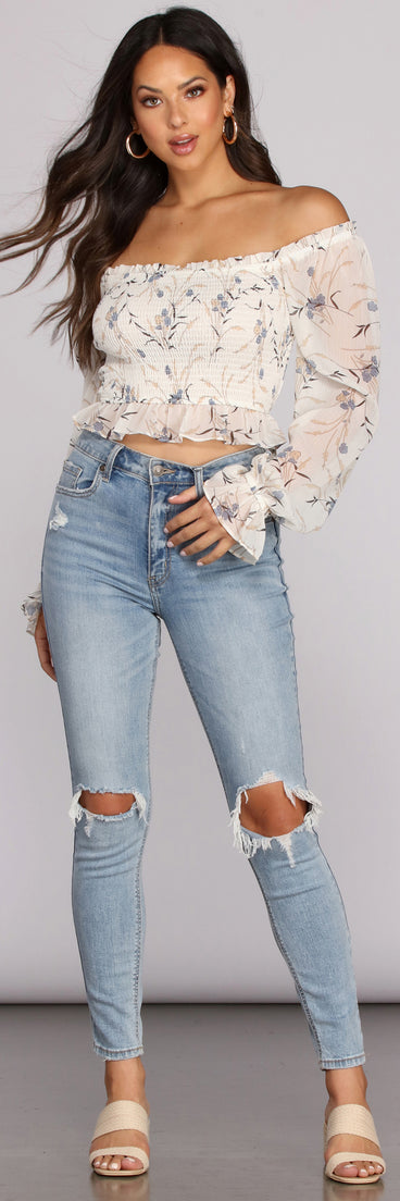 With fun and flirty details, Charming Florals Smocked Crop Top shows off your unique style for a trendy outfit for the summer season!